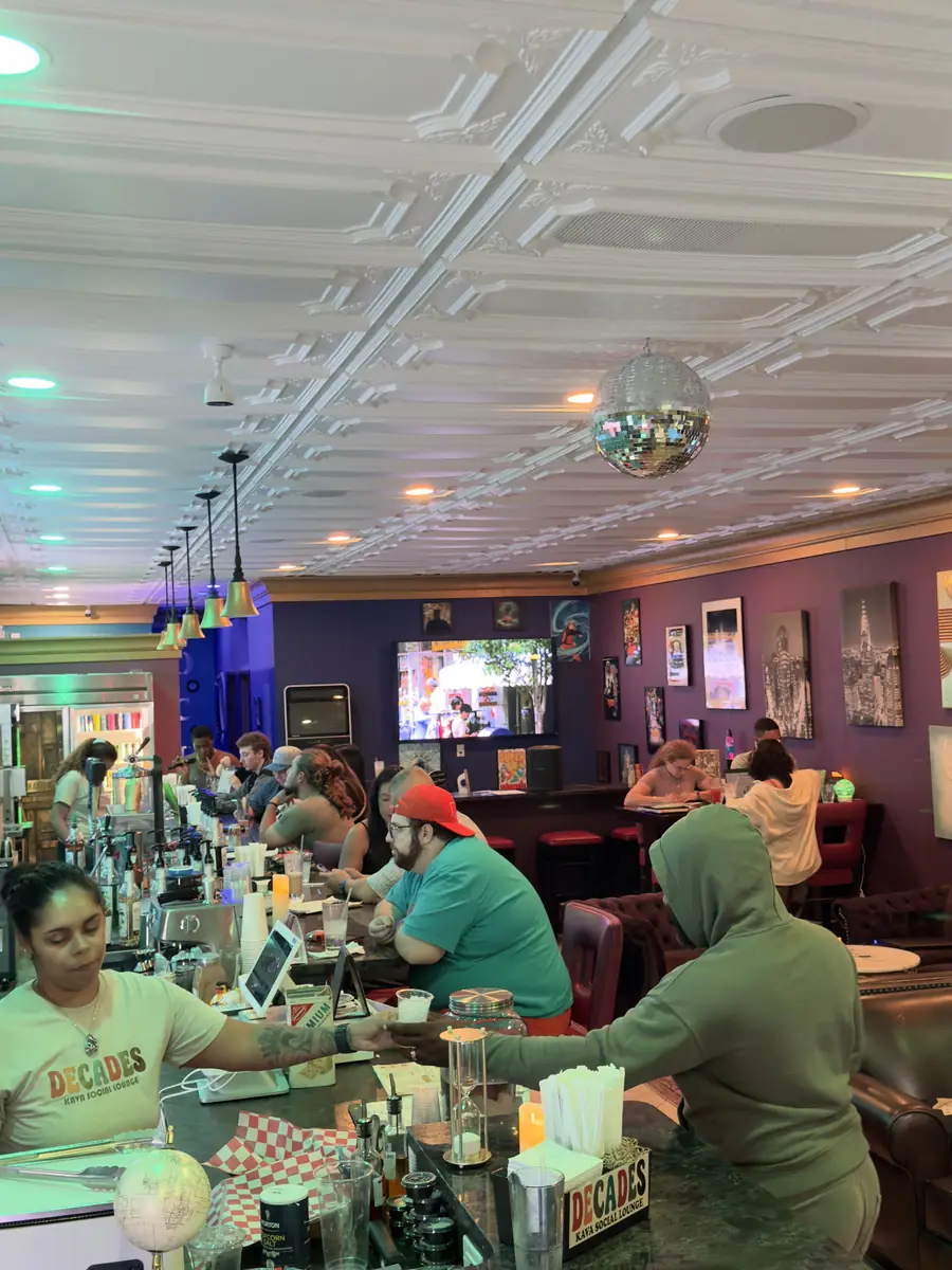 Guests working and hanging out at the bar during the day