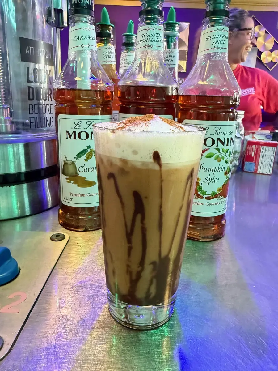 An iced fall latte with chocolate drizzle