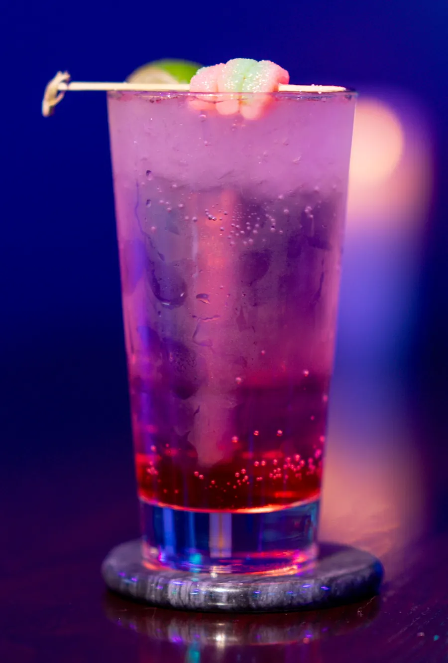 The Barbie mitra mocktail, sparkling watermelon with lime and a gummy candy garnish, at Decades Kava in Longwood, FL